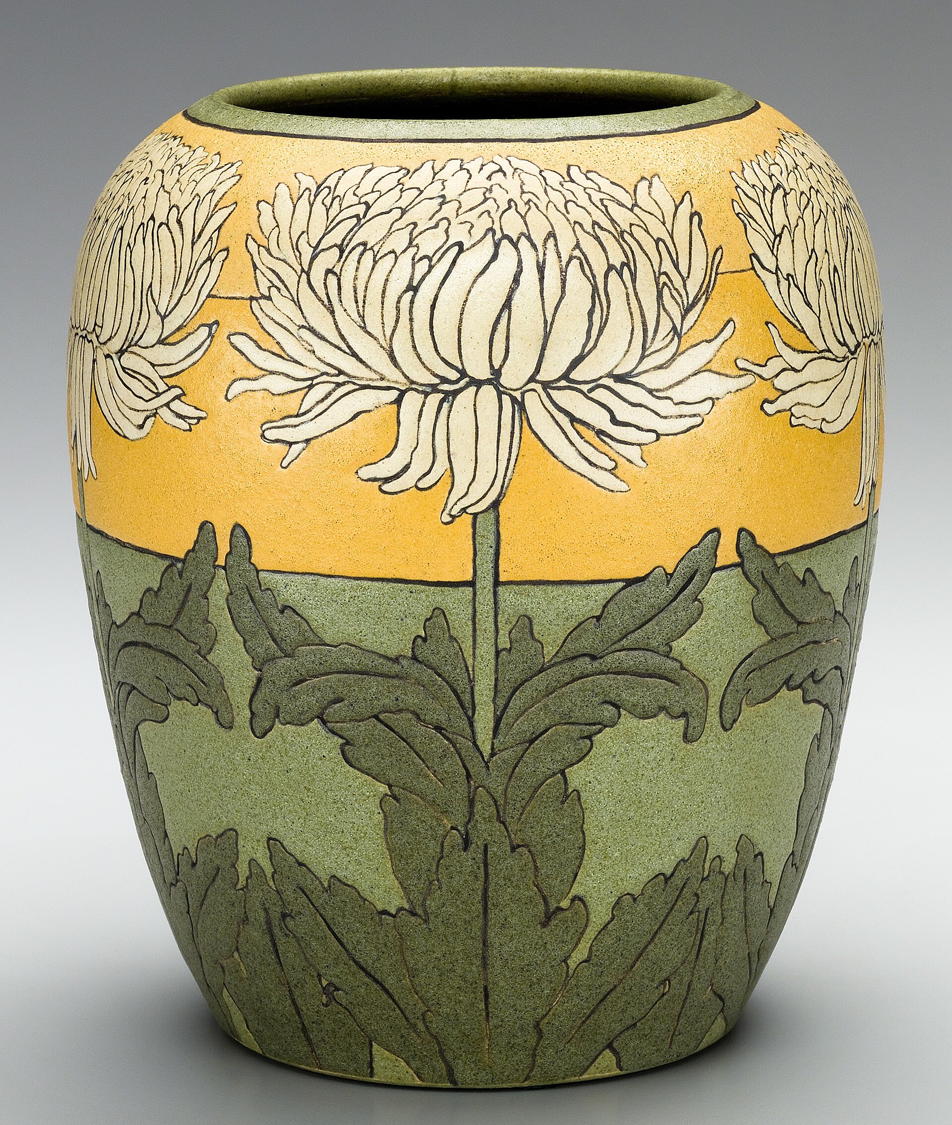 A tall stoneware vessel with a soft matte glaze, shot in flat studio light